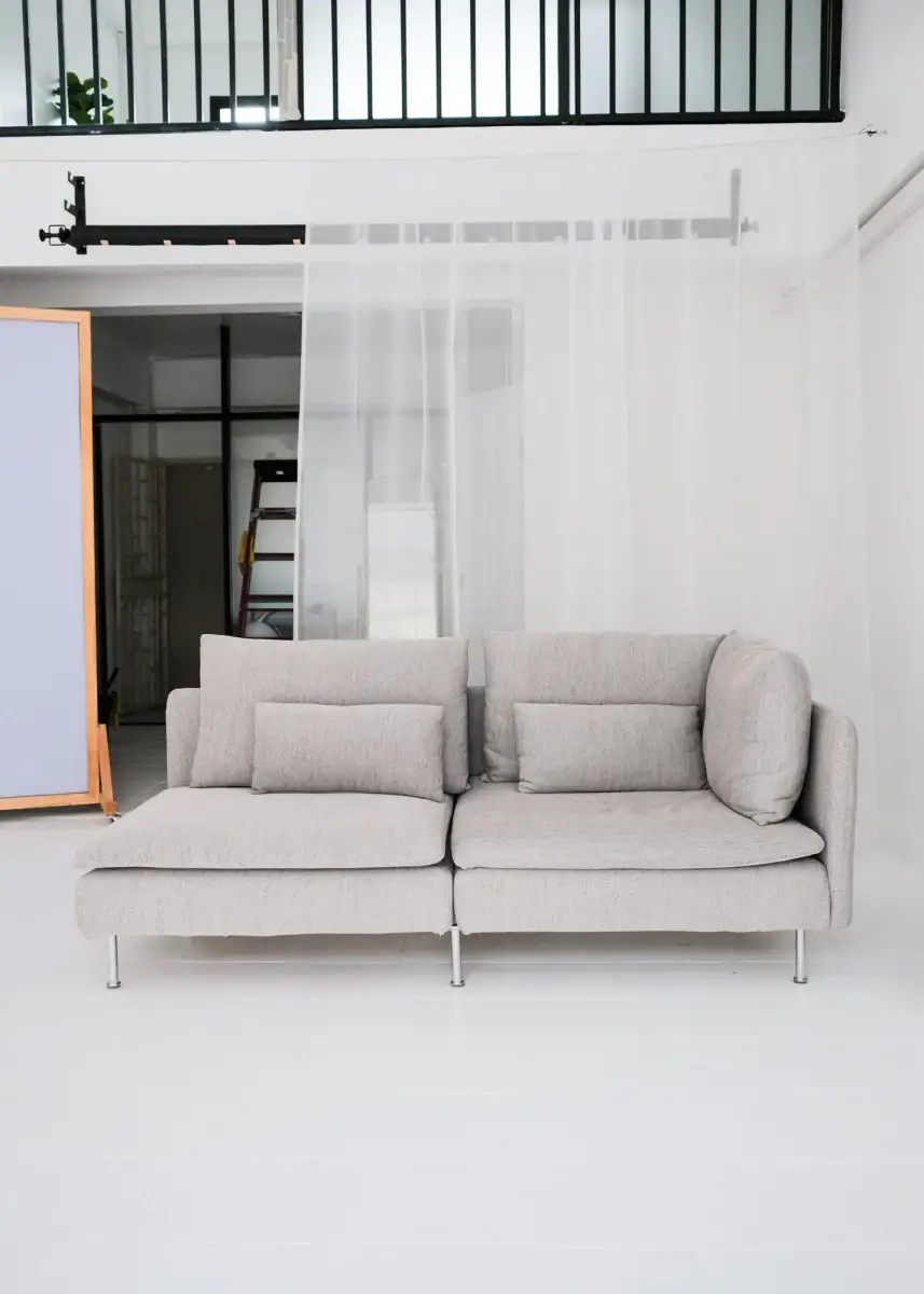 Lifestyle photo studio in Chiang Mai showing a minimalist grey sofa setup